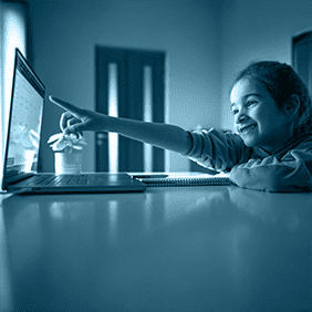 Young girl using Mazaya Rawdah interactive system for educational activities management in nursery