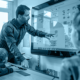 Teacher instructing students with interactive whiteboard in mazaya schoolna system